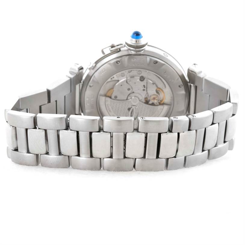 The image shows a rear view of the Cartier Pasha W31037H3 Men's Stainless Steel Silver Dial W31037H3 Men's Stainless Steel Silver Dial model watch, highlighting its metal bracelet and mechanical movement through the transparent case back.