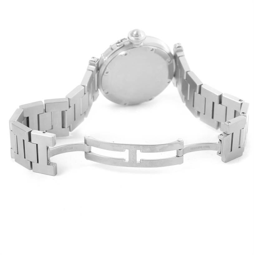 The image shows the back and open stainless steel bracelet of a Cartier Pasha W31074M7 Women's Stainless Steel White Dial W31074M7 Women's Stainless Steel White Dial watch at an angle highlighting the clasp and case back.