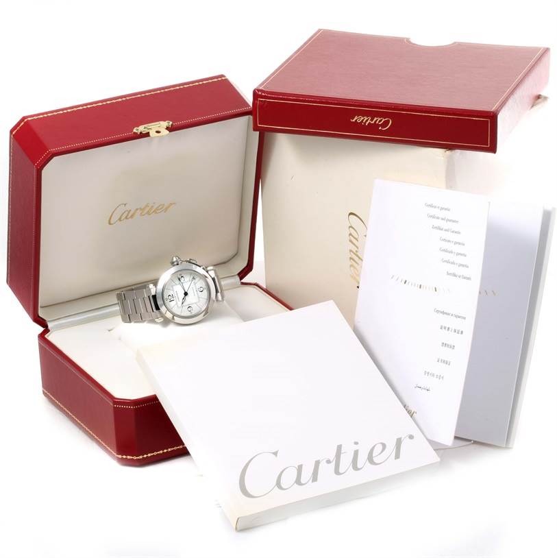The Cartier Pasha W31074M7 Women's Stainless Steel White Dial W31074M7 Women's Stainless Steel White Dial watch is displayed in its open red box with accompanying documentation and outer packaging.