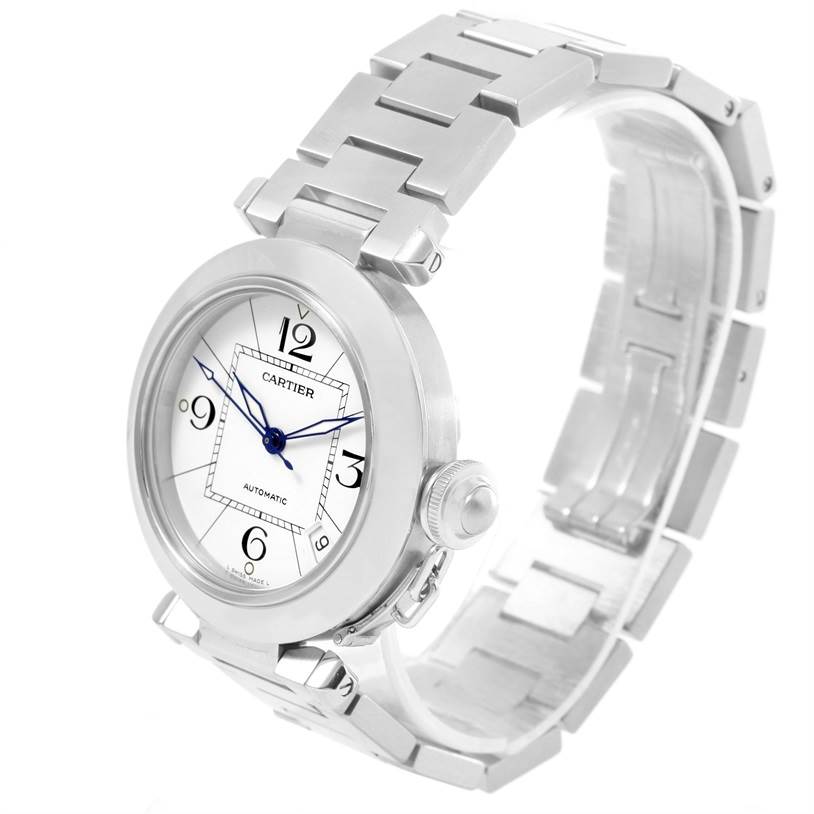 The image shows a Cartier Pasha W31074M7 Women's Stainless Steel White Dial W31074M7 Women's Stainless Steel White Dial watch at a three-quarter view, highlighting the face, bezel, crown, and bracelet.