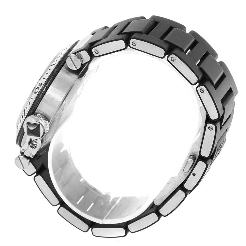 The image shows a side view of a Cartier Pasha W31077U2 Men's Stainless Steel Black Dial W31077U2 Men's Stainless Steel Black Dial watch, focusing on the case, crown, and part of the bracelet.