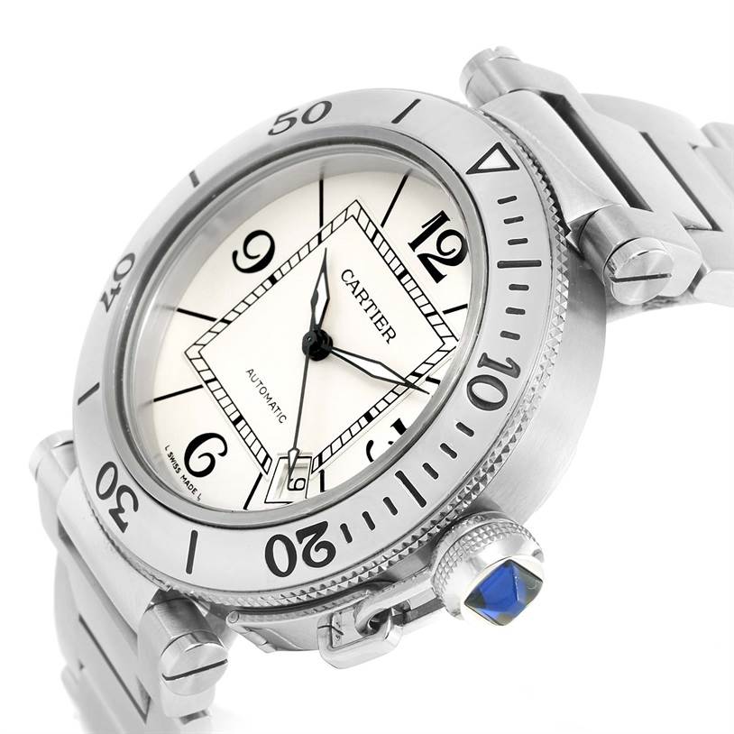 This Cartier Pasha W31080M7 Men
s Stainless Steel Silver Dial W31080M7 Men
s Stainless Steel Silver Dial watch is shown from a slight side angle, highlighting the dial, crown with blue cabochon, and part of the metal bracelet.