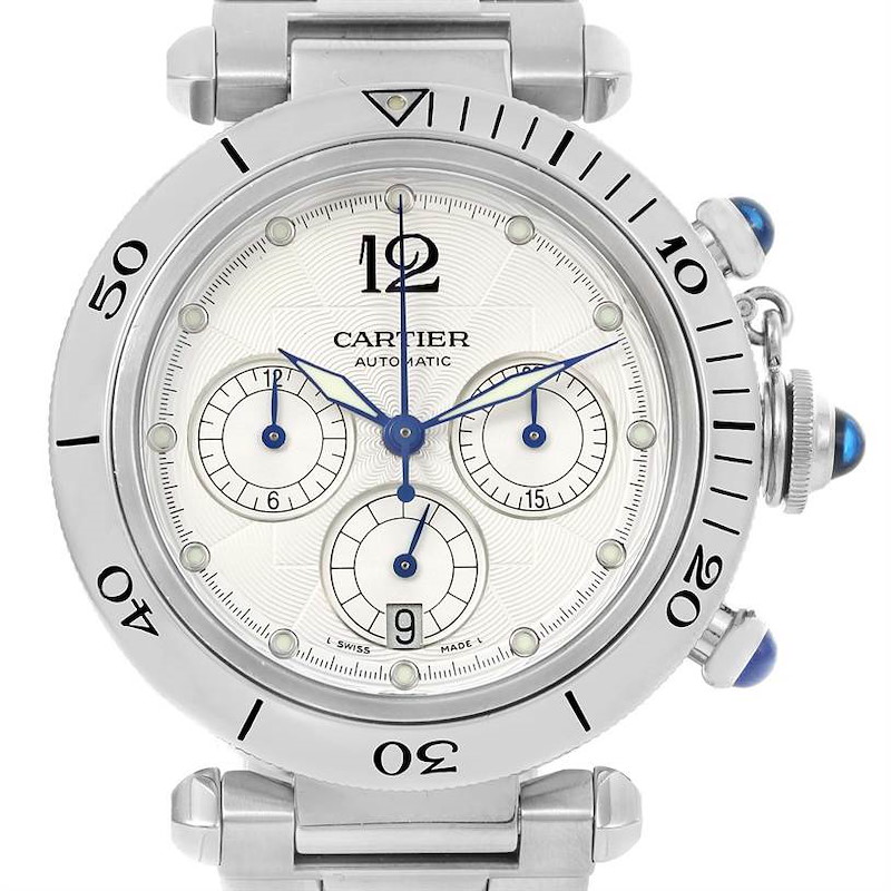 The image is a front view of the Cartier Pasha model, showing its dial, bezel, and crown with blue cabochon accents.