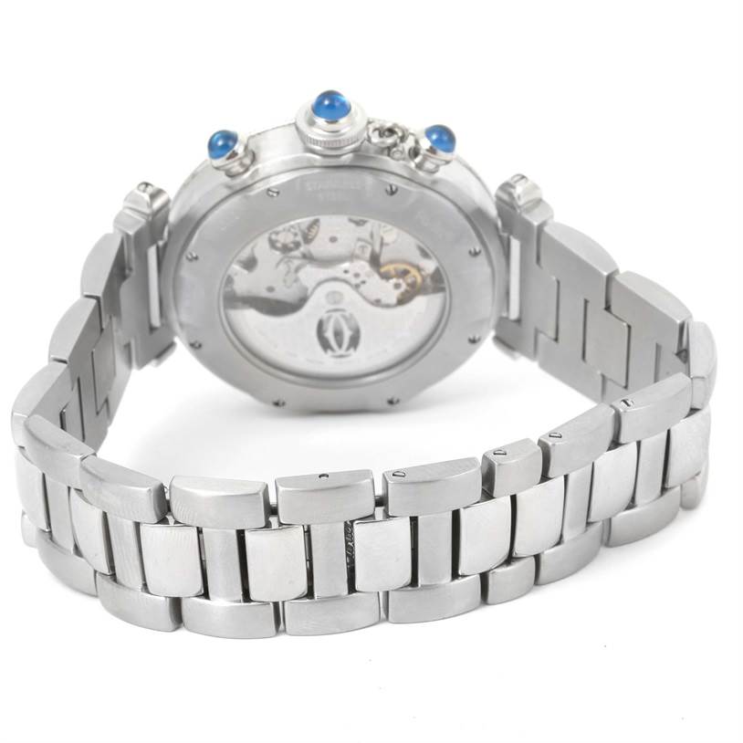 The image displays the back and bracelet of a Cartier Pasha W31030H3 Men's Silver Dial W31030H3 Men's Silver Dial watch, showcasing its movement and blue cabochon crown.