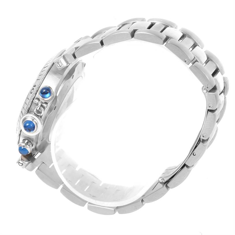 This image shows a side view of the Cartier Pasha W31030H3 Men's Silver Dial W31030H3 Men's Silver Dial watch, highlighting the bracelet and blue-stoned crown and pushers.