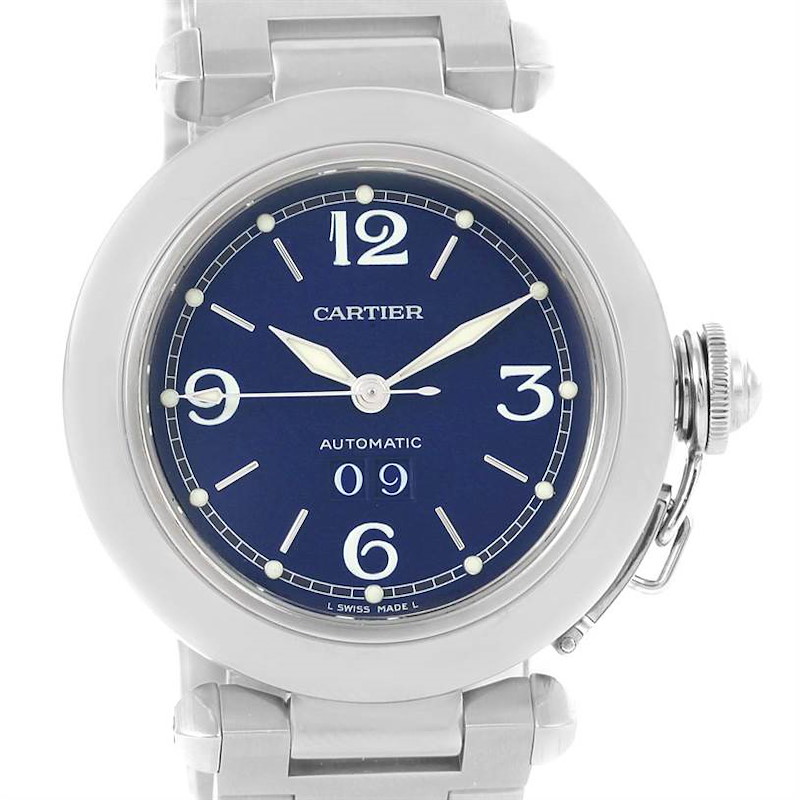 The image shows the front view of a Cartier Pasha watch, highlighting the blue dial, numerals, hands, and part of the bracelet.