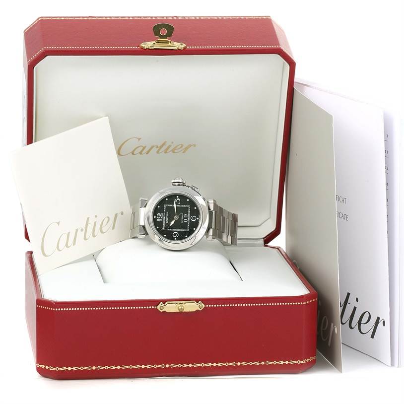 The Cartier Pasha W31055M7 Men's Stainless Steel Black Dial W31055M7 Men's Stainless Steel Black Dial watch is shown in an open red box with accompanying documents.