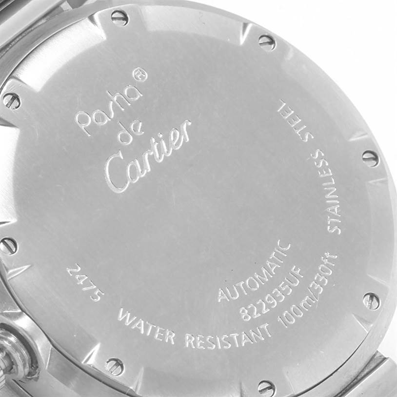 The image shows the back case of a Cartier Pasha W31055M7 Men's Stainless Steel Black Dial W31055M7 Men's Stainless Steel Black Dial watch, including engravings and screws.