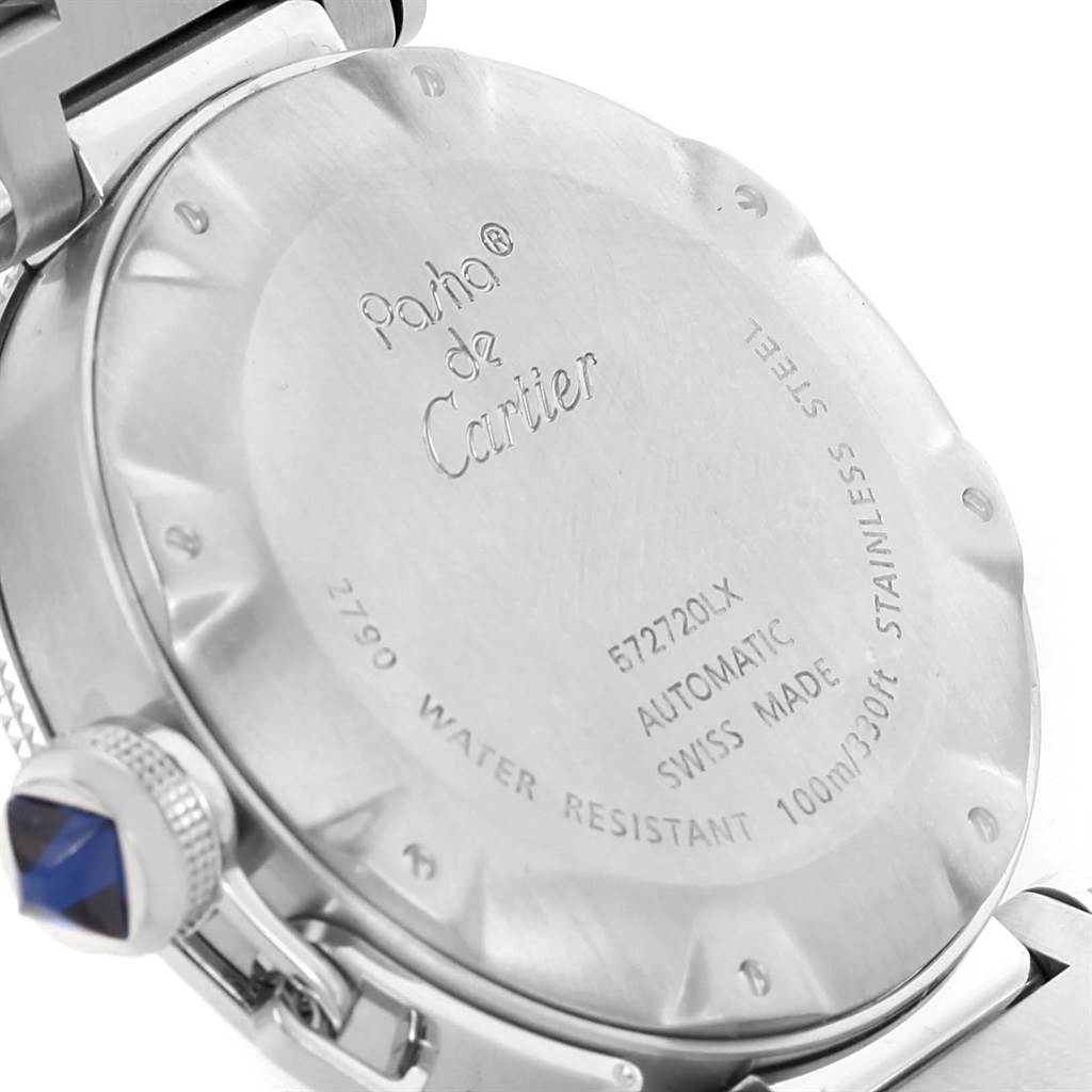 This image shows the case back and crown of a Pasha model watch by Cartier, viewed from a rear angle.