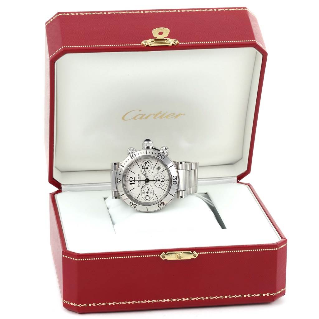 The Cartier Pasha W31089M7 Men
s Stainless Steel Silver Dial W31089M7 Men
s Stainless Steel Silver Dial watch is photographed head-on in its branded red and white box.
