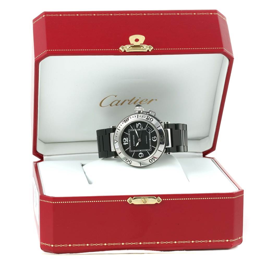 The Cartier Pasha W31077U2 Men's Stainless Steel Black Dial W31077U2 Men's Stainless Steel Black Dial watch is displayed in an open red box with the face, bezel, and strap clearly visible.