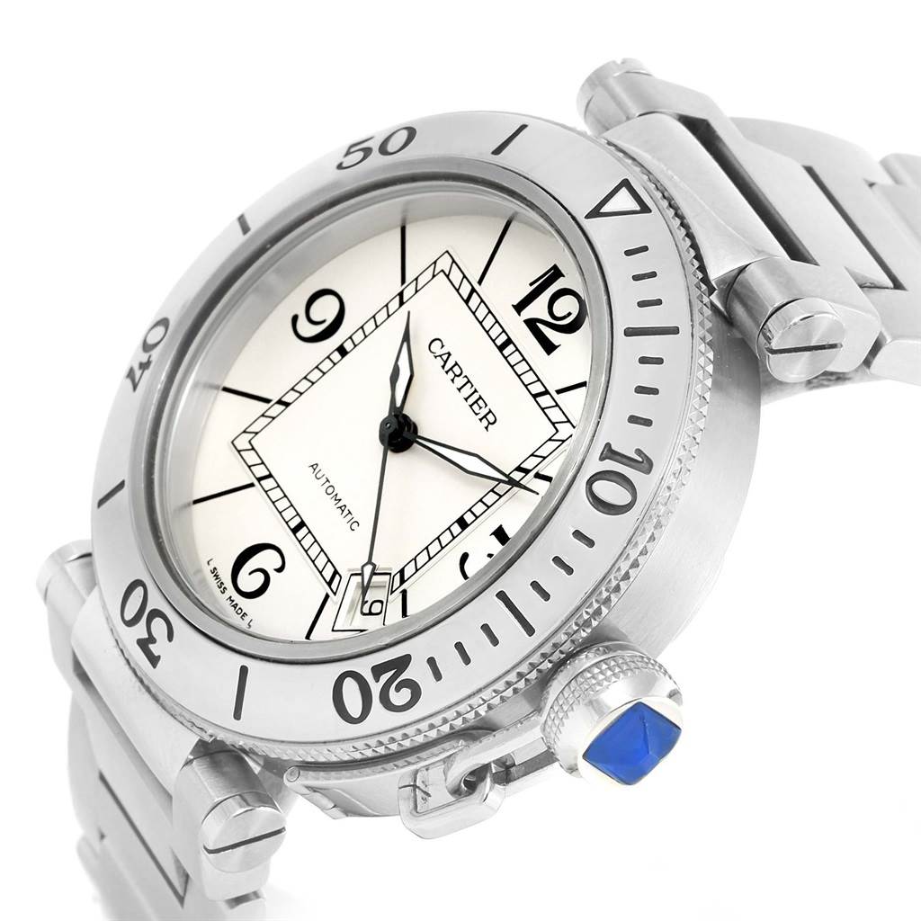 The image shows a close-up angled view of the Cartier Pasha W31080M7 Men's Stainless Steel Silver Dial W31080M7 Men's Stainless Steel Silver Dial watch, highlighting its face, bezel, crown, and parts of the bracelet.