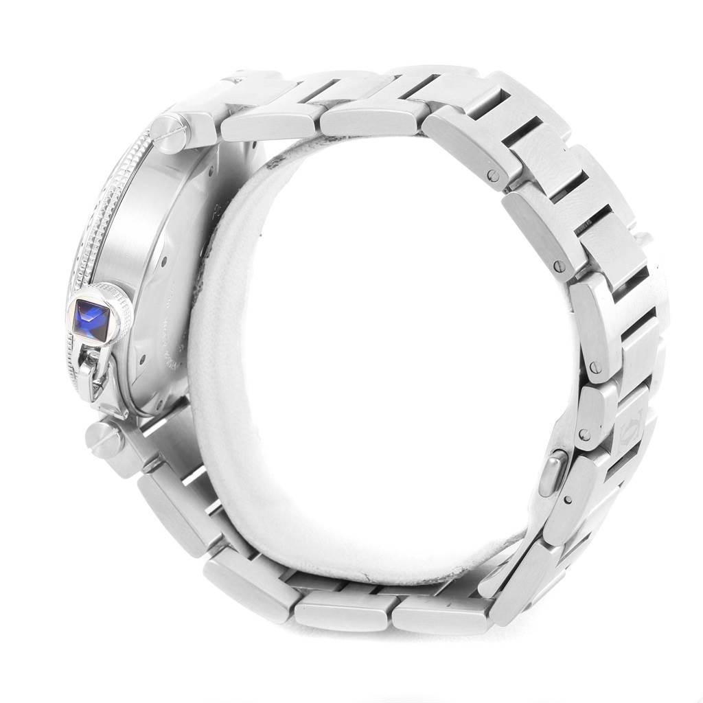 The image shows a side view of the Cartier Pasha W31080M7 Men
s Stainless Steel Silver Dial W31080M7 Men
s Stainless Steel Silver Dial watch, highlighting the bracelet and the blue cabochon crown.