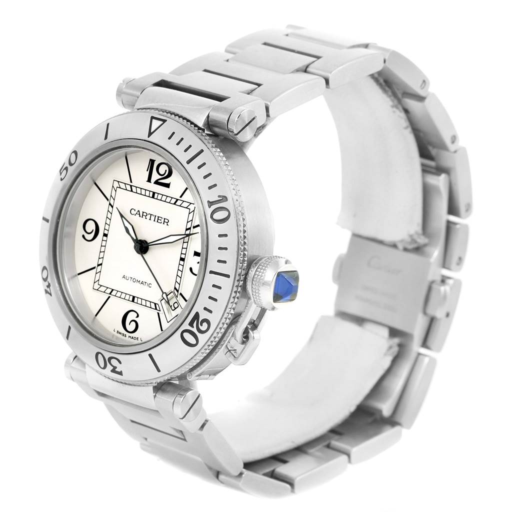 The image shows a side-angle view of the Cartier Pasha W31080M7 Men
s Stainless Steel Silver Dial W31080M7 Men
s Stainless Steel Silver Dial watch, highlighting its bezel, dial, crown, and metal bracelet.