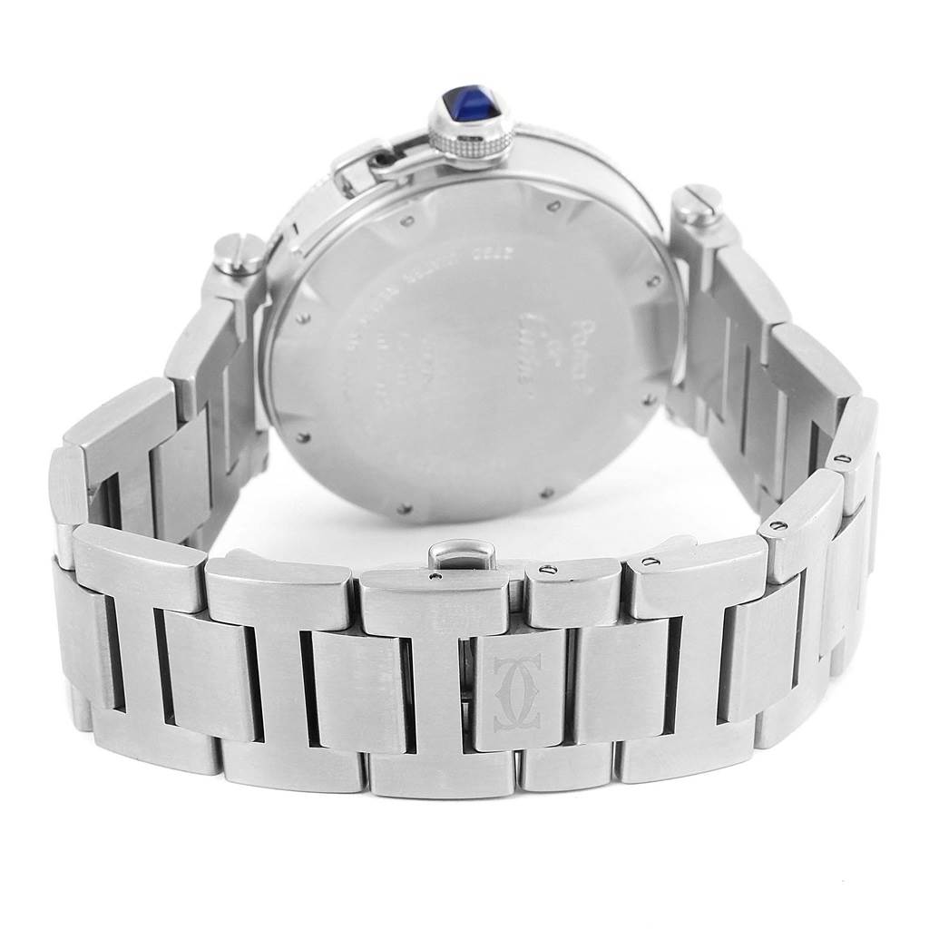 The image shows the back view of the Pasha model by Cartier, highlighting the stainless steel strap and the watch case back.