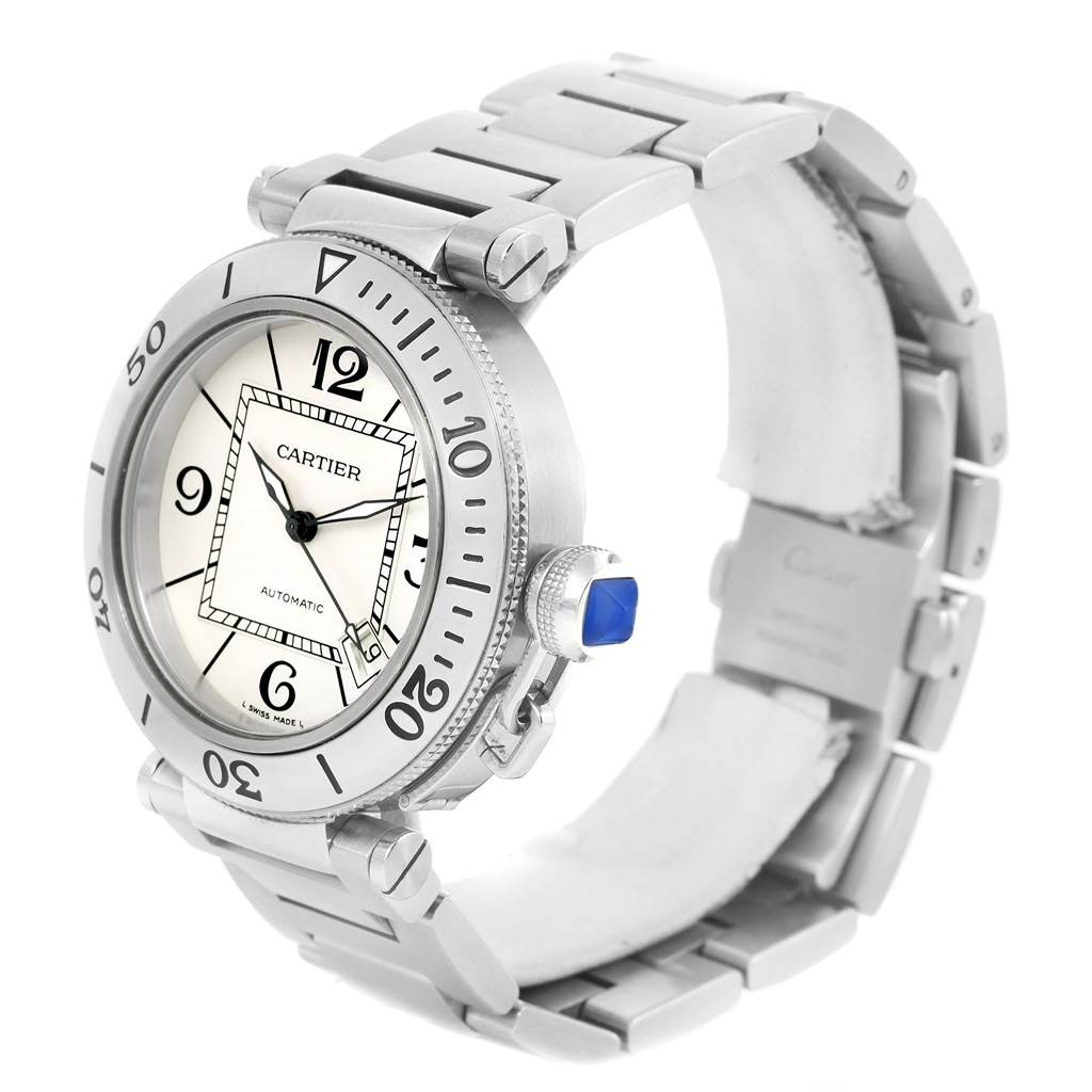 The image shows a Cartier Pasha W31080M7 Men
s Stainless Steel Silver Dial W31080M7 Men
s Stainless Steel Silver Dial watch from a three-quarter angle, displaying its dial, crown, and stainless steel bracelet.