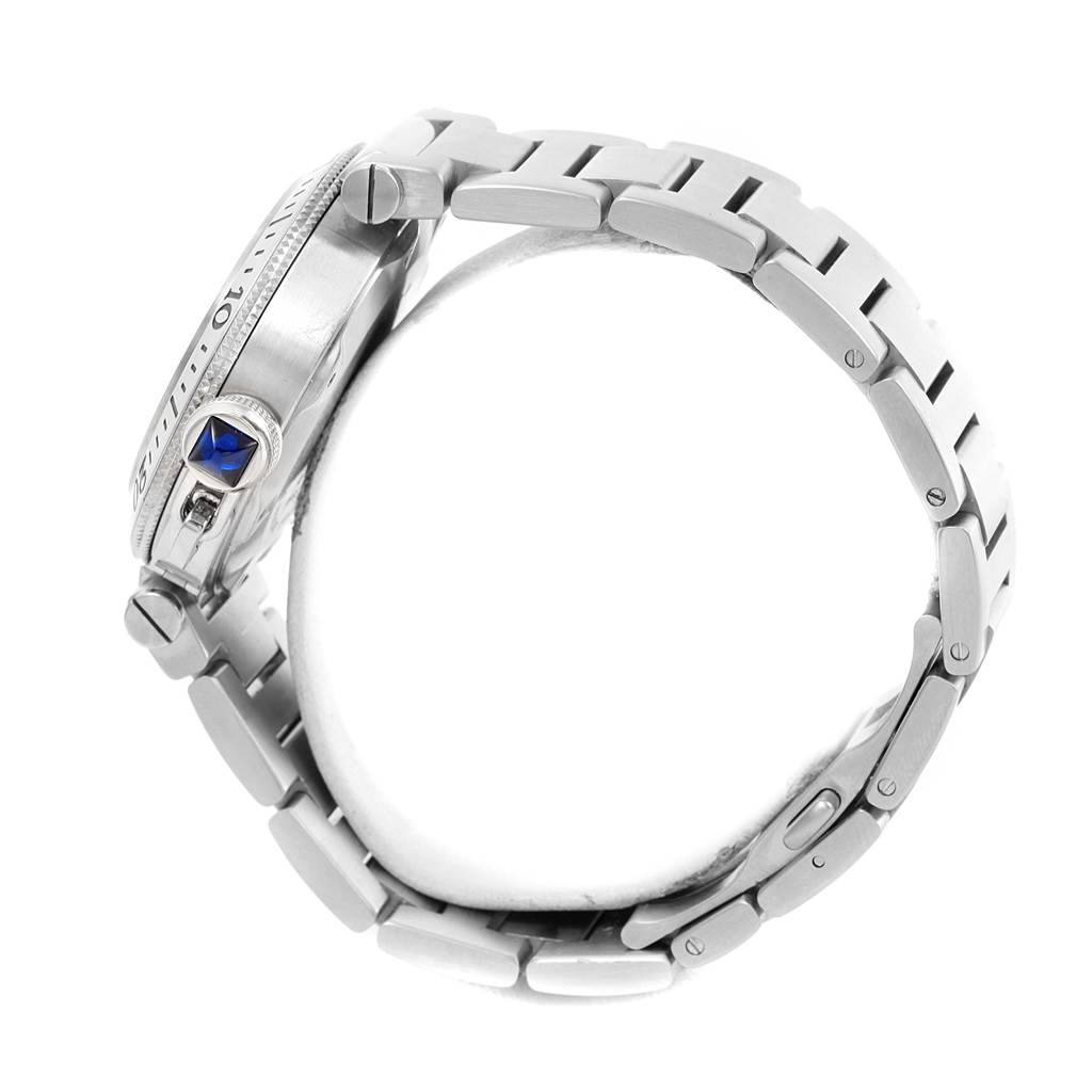 The image shows a side view of the Cartier Pasha W31080M7 Men
s Stainless Steel Silver Dial W31080M7 Men
s Stainless Steel Silver Dial watch, featuring its crown guard, bezel, and metal bracelet.