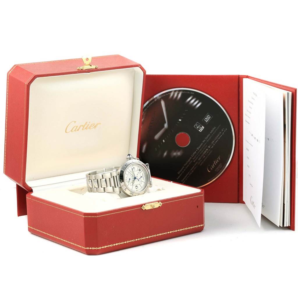 The Cartier Pasha W31037H3 Men's Stainless Steel Silver Dial W31037H3 Men's Stainless Steel Silver Dial watch is displayed in an open red box with a CD and documentation beside it.