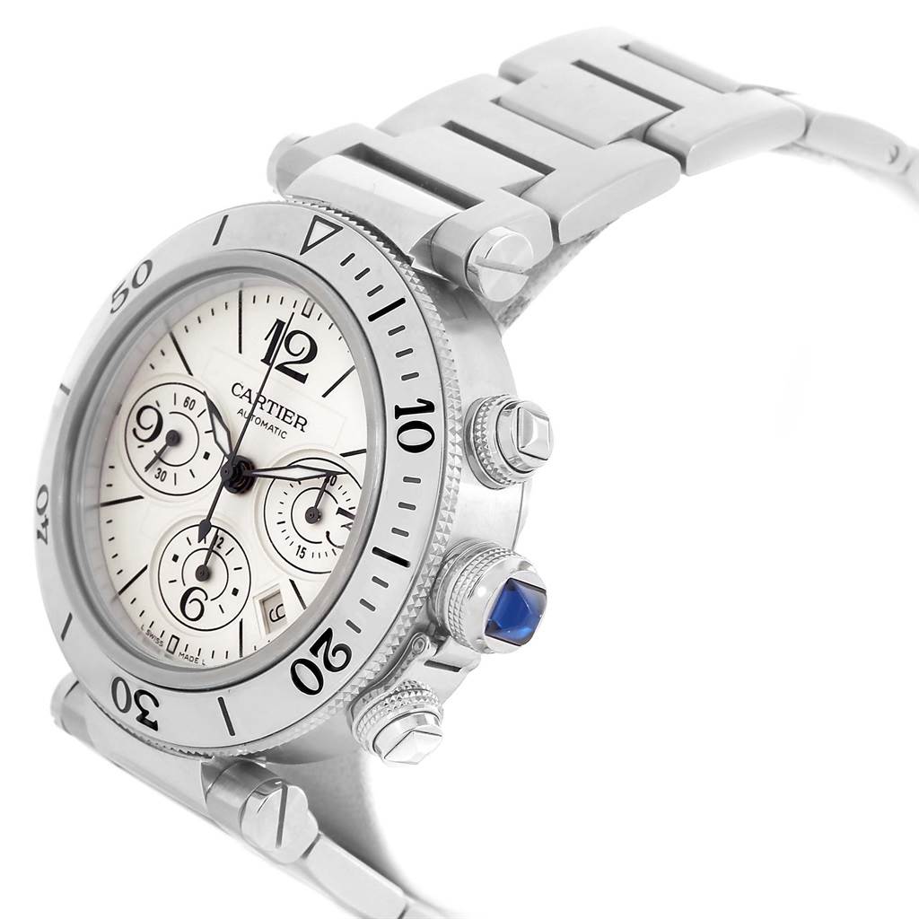 The image shows a Cartier Pasha W31089M7 Men's Stainless Steel Silver Dial W31089M7 Men's Stainless Steel Silver Dial watch at an angle highlighting its face, bezel, crown, and part of the metal bracelet.