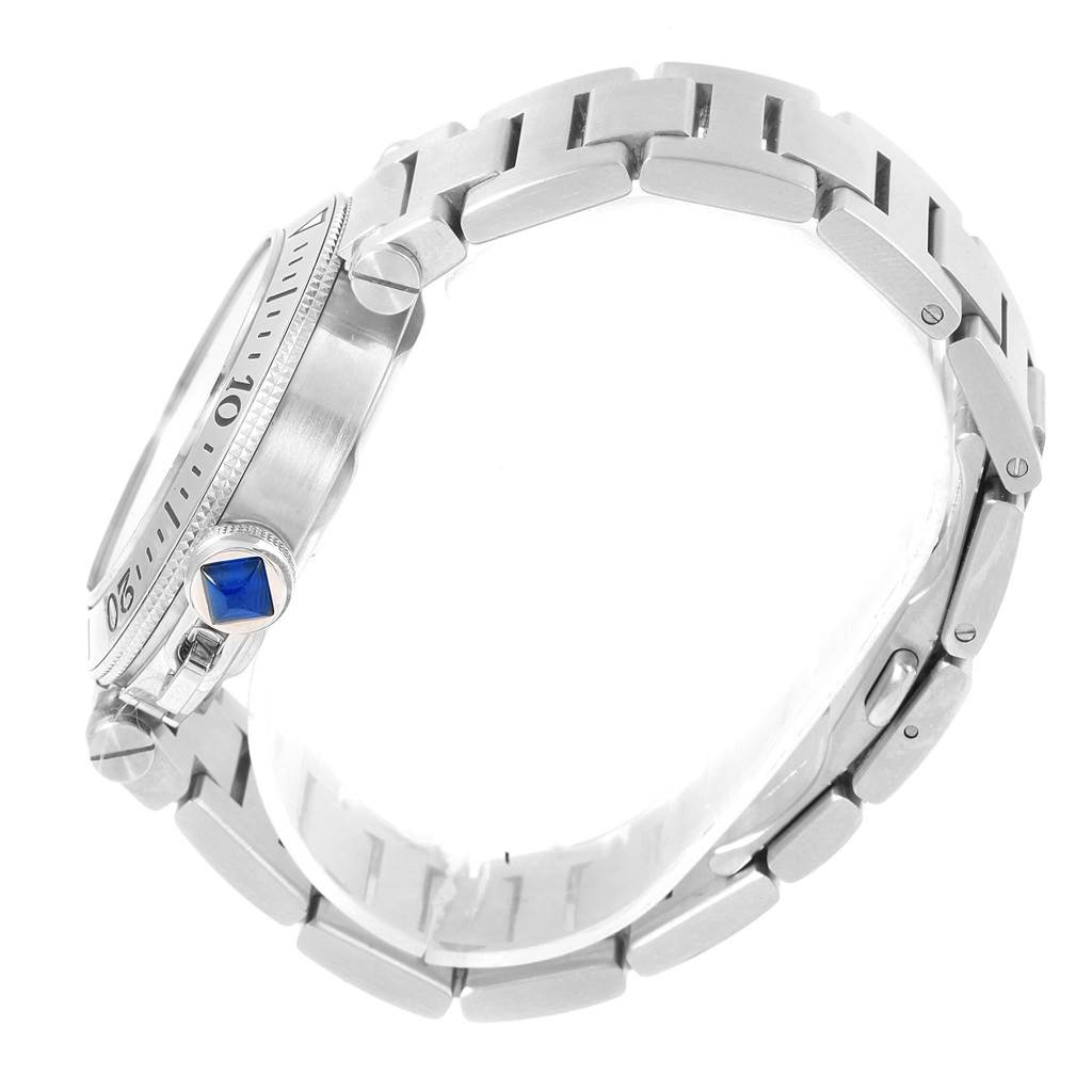 This image shows a side view of the Cartier Pasha W31080M7 Men's Stainless Steel Silver Dial W31080M7 Men's Stainless Steel Silver Dial watch, focusing on the bezel, crown with blue cabochon, and the metal bracelet.