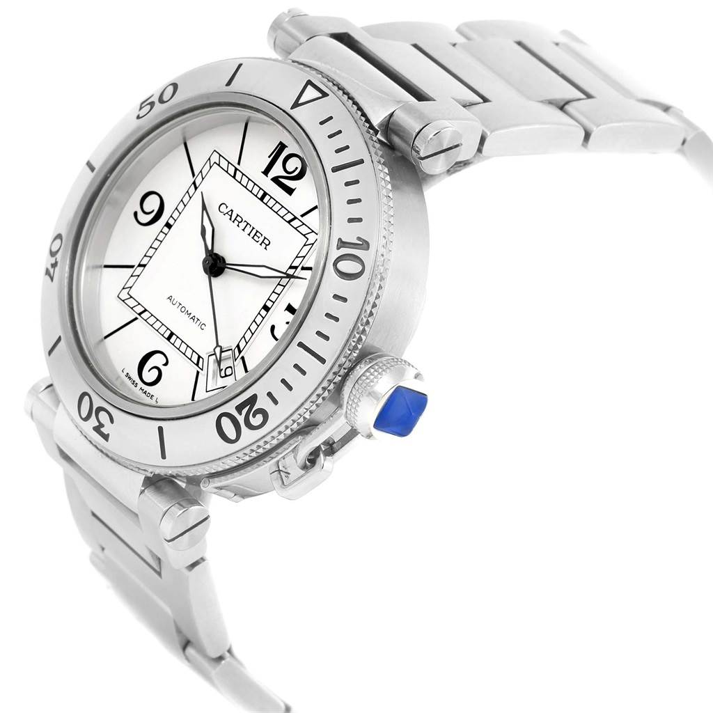The image shows a Cartier Pasha W31080M7 Men
s Stainless Steel Silver Dial W31080M7 Men
s Stainless Steel Silver Dial watch angled to display the dial, bezel, crown with blue cabochon, and part of the bracelet.