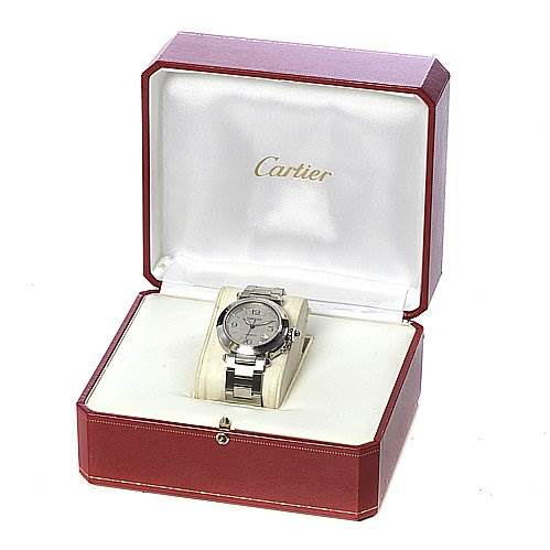 The Pasha model by Cartier is shown from a front angle inside a red and white Cartier box.