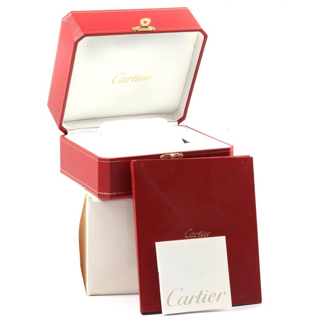 The image shows the packaging of a Cartier Pasha W31077U2 Men's Stainless Steel Black Dial W31077U2 Men's Stainless Steel Black Dial watch, including a red box, booklet, and white inner lining.