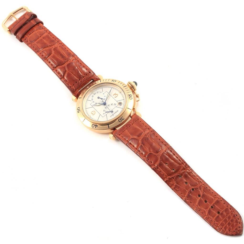 This Cartier Pasha W30144D1 Men's Yellow Gold Silver Dial W30144D1 Men's Yellow Gold Silver Dial watch is shown from an overhead angle displaying its face, bezel, crown, and brown leather strap.