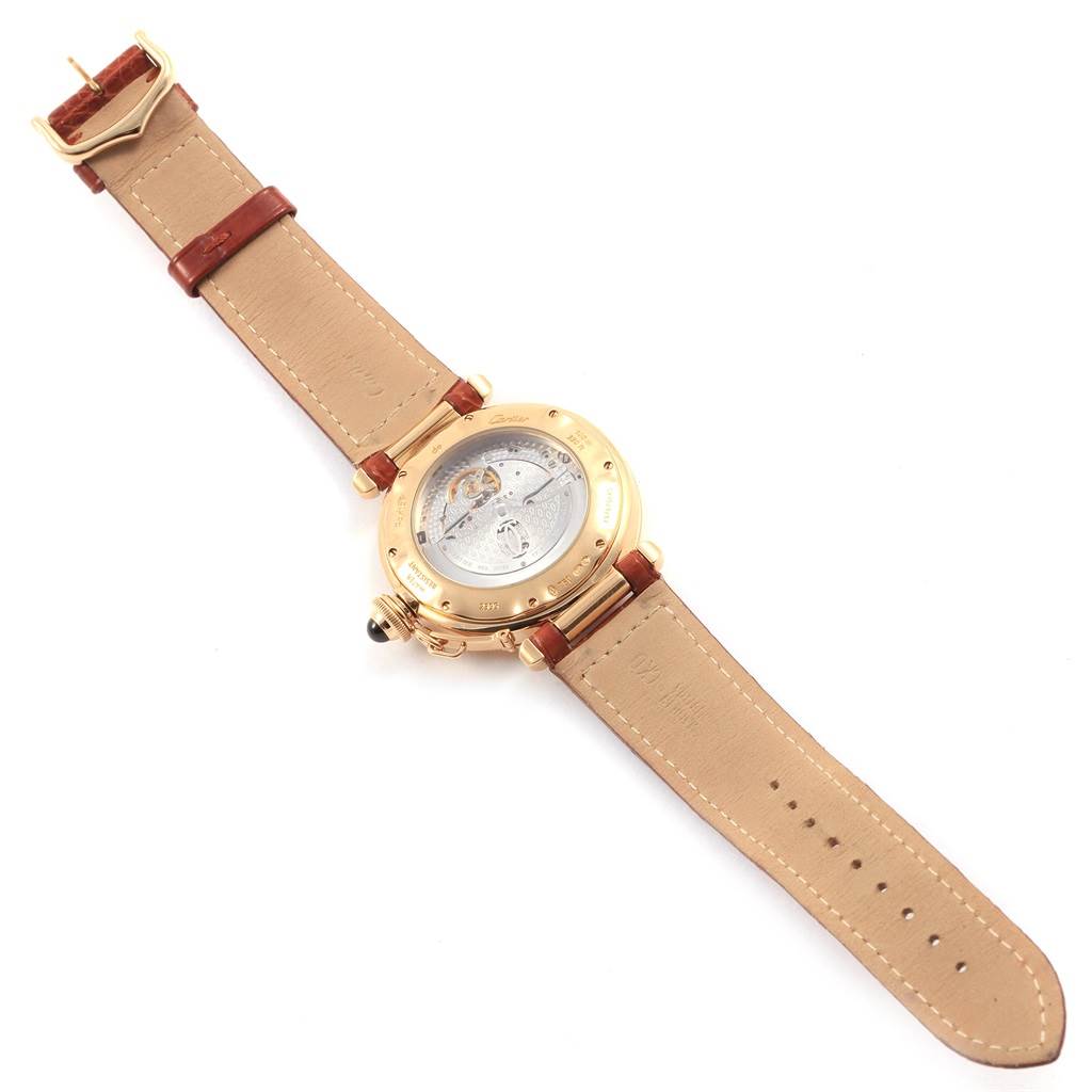 The image shows the backside and strap of a Cartier Pasha W30144D1 Men's Yellow Gold Silver Dial W30144D1 Men's Yellow Gold Silver Dial watch, highlighting its movement and clasp.