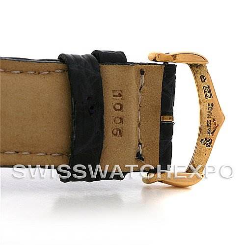 This image shows a close-up of the leather strap and gold clasp of a Cartier Pasha Women's Yellow Gold Silver Dial Women's Yellow Gold Silver Dial watch.