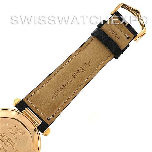 The image shows the back of a Cartier Pasha Women's Yellow Gold Silver Dial Women's Yellow Gold Silver Dial watch and a close-up of its leather strap.