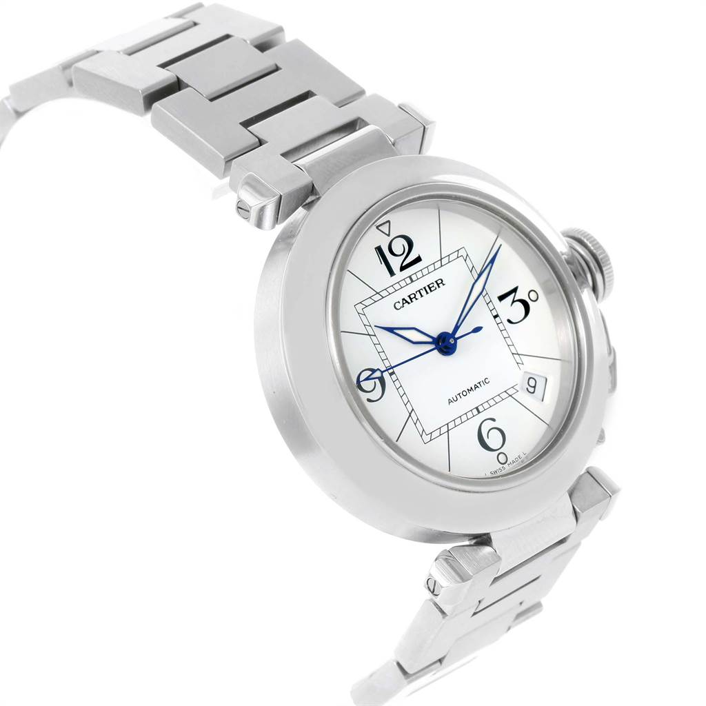 The Cartier Pasha W31074M7 Stainless Steel White Dial W31074M7 Stainless Steel White Dial watch is shown at an angle highlighting the face, bezel, crown, and part of the metal bracelet.