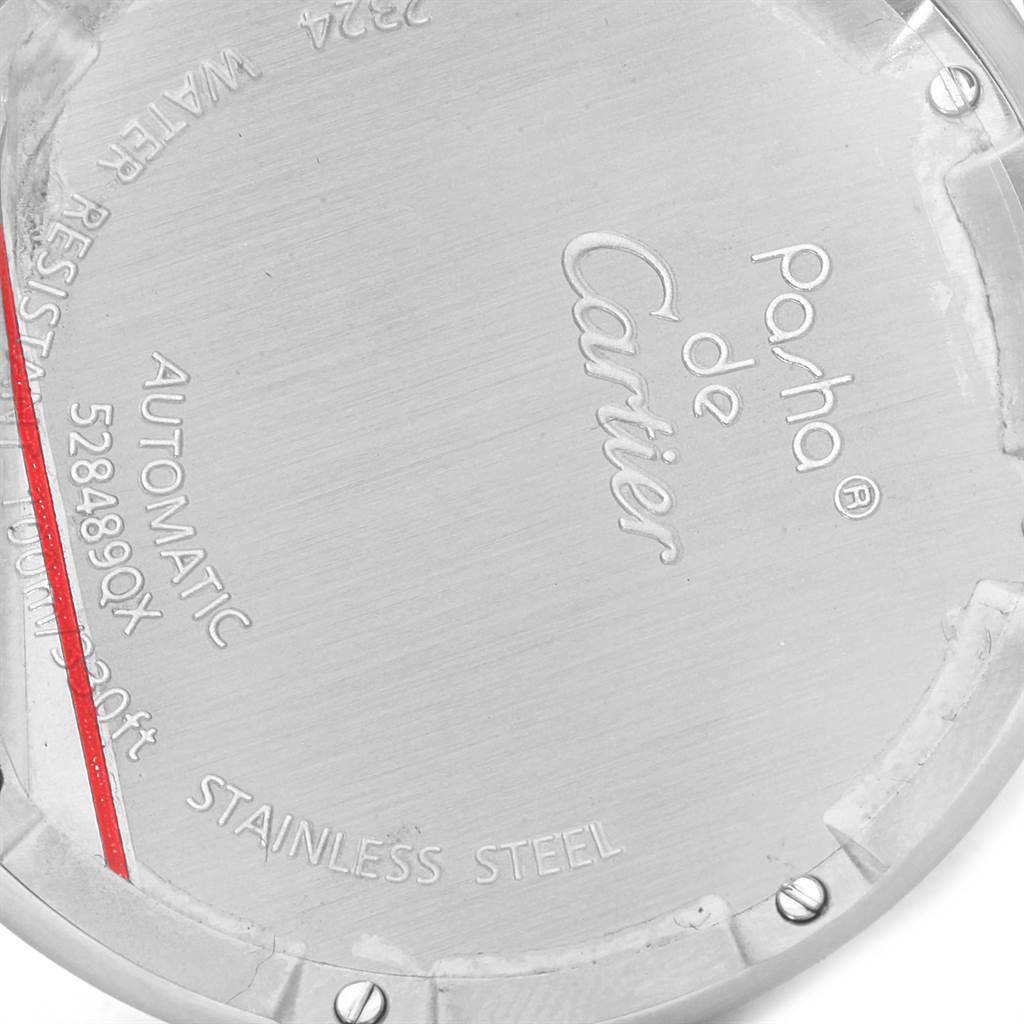 The image shows the back case of a Pasha de Cartier watch, highlighting the brand, model, and material details.