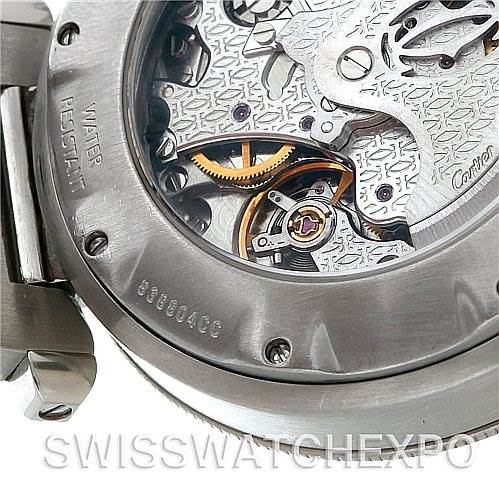This close-up shows the back side of the Cartier Pasha W31030H3 Women
s Stainless Steel Silver Dial W31030H3 Women
s Stainless Steel Silver Dial watch, highlighting its intricate mechanism and visible engravings.