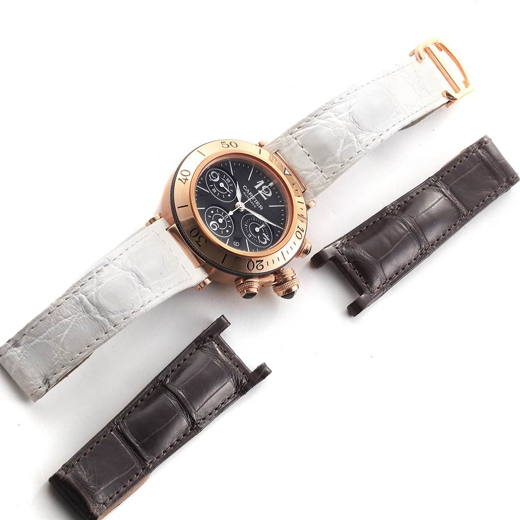 This Cartier Pasha W3030018 Men's Rose Gold Black Dial W3030018 Men's Rose Gold Black Dial watch is shown from a top-down angle with white and brown leather straps.