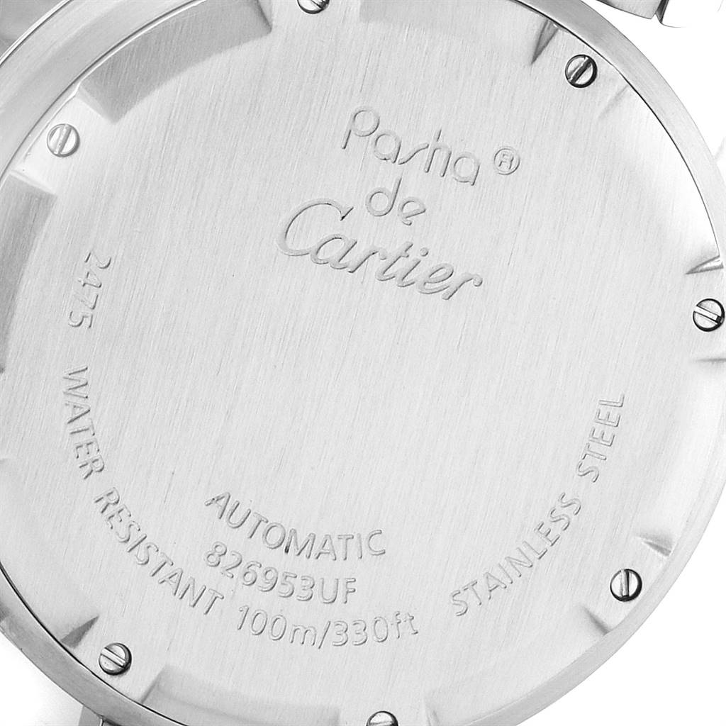 The image shows the back case of a Cartier Pasha W31055M7 Men's Stainless Steel White Dial W31055M7 Men's Stainless Steel White Dial watch, highlighting its inscriptions and screws.