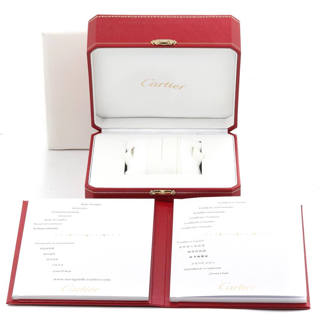 The image shows the Cartier Pasha W31074M7 Stainless Steel White Dial W31074M7 Stainless Steel White Dial watch box and accompanying documentation from a top-down angle.