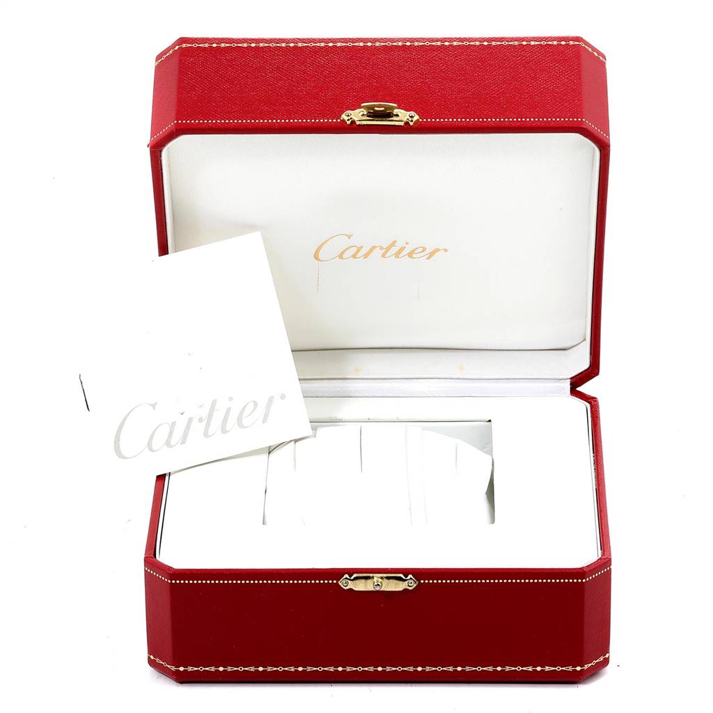 The image shows an open red Cartier watch box, possibly for the Pasha model, with a Cartier booklet inside.