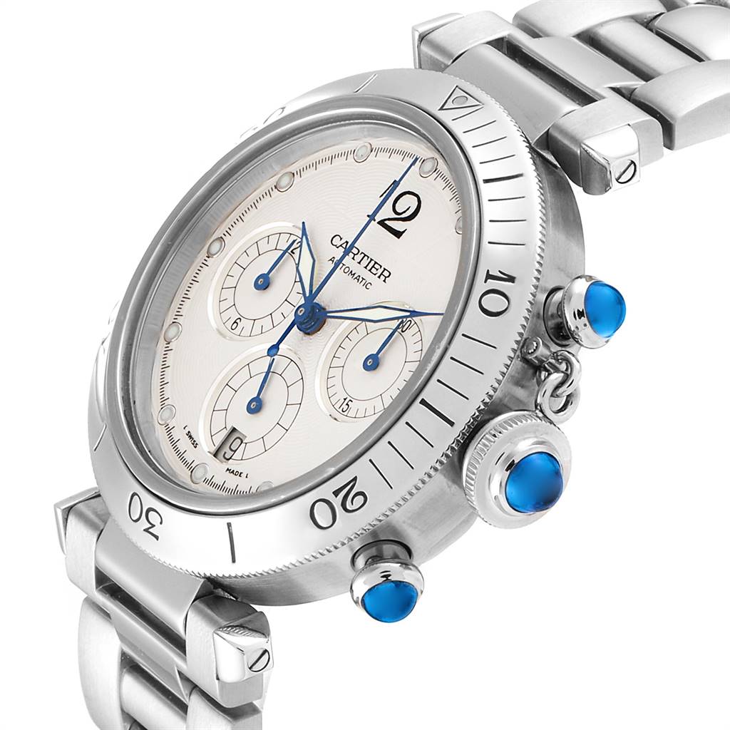 This image shows a close-up angle of the Cartier Pasha W31030H3 Men
s Stainless Steel Silver Dial W31030H3 Men
s Stainless Steel Silver Dial watch, displaying its dial, bezel, and blue cabochon-capped crown and pushers.
