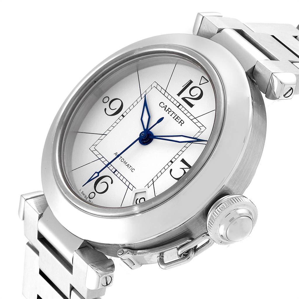 The image shows a close-up, angled view of a Cartier Pasha W31074M7 Stainless Steel White Dial W31074M7 Stainless Steel White Dial watch, focusing on the dial, bezel, crown, and part of the bracelet.