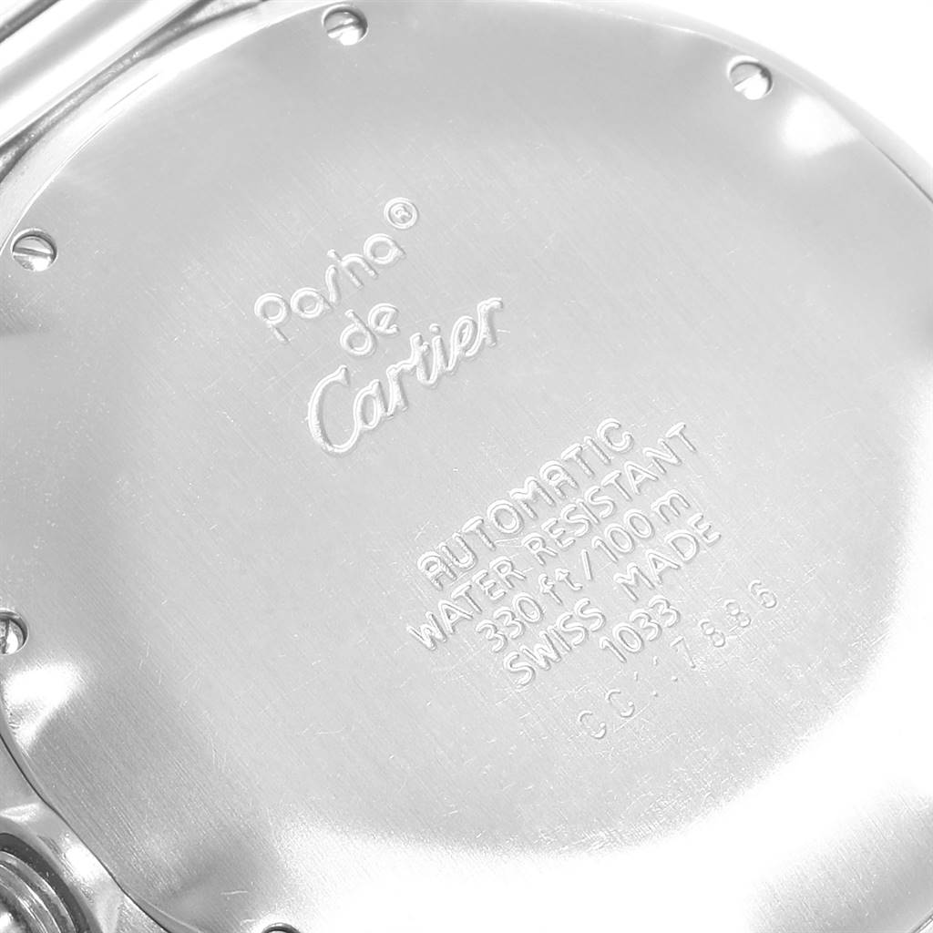 Close-up of the back case of a Cartier Pasha W31012H3 Men's Stainless Steel Silver Dial W31012H3 Men's Stainless Steel Silver Dial watch, showing the engraved brand details and specifications.