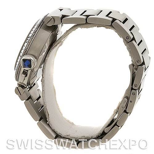 The image shows a side view of the Cartier Pasha W31080M7 Men's Stainless Steel White Dial W31080M7 Men's Stainless Steel White Dial watch, highlighting its band, crown with a blue gem, and bezel.