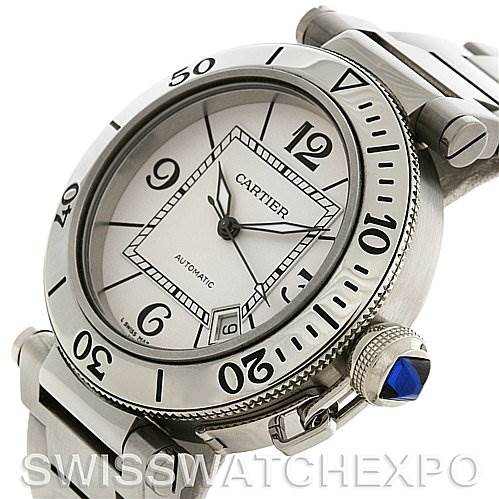 The image shows a close-up angled view of the Cartier Pasha W31080M7 Men's Stainless Steel White Dial W31080M7 Men's Stainless Steel White Dial watch, highlighting the dial, bezel, crown, and part of the bracelet.