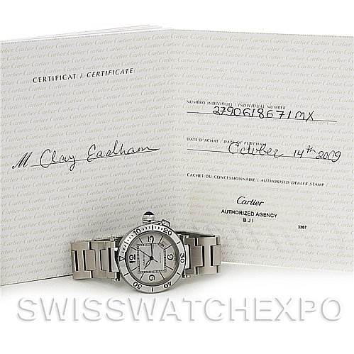 The image shows a Cartier Pasha W31080M7 Men's Stainless Steel White Dial W31080M7 Men's Stainless Steel White Dial watch placed in front of its certificate of authenticity.