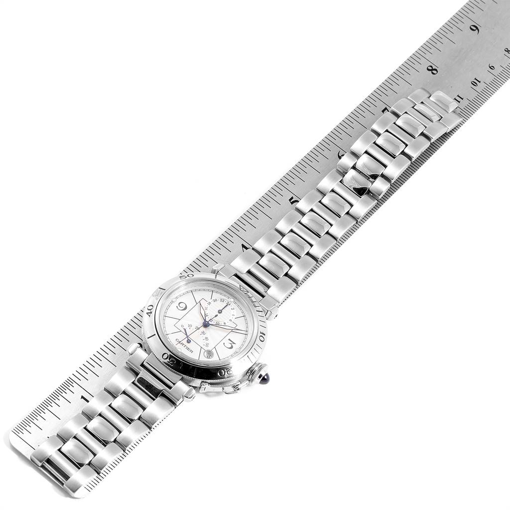 The image shows the Cartier Pasha W31037H3 Men
s Stainless Steel Silver Dial W31037H3 Men
s Stainless Steel Silver Dial model watch laid flat alongside a ruler, displaying its full bracelet and face.