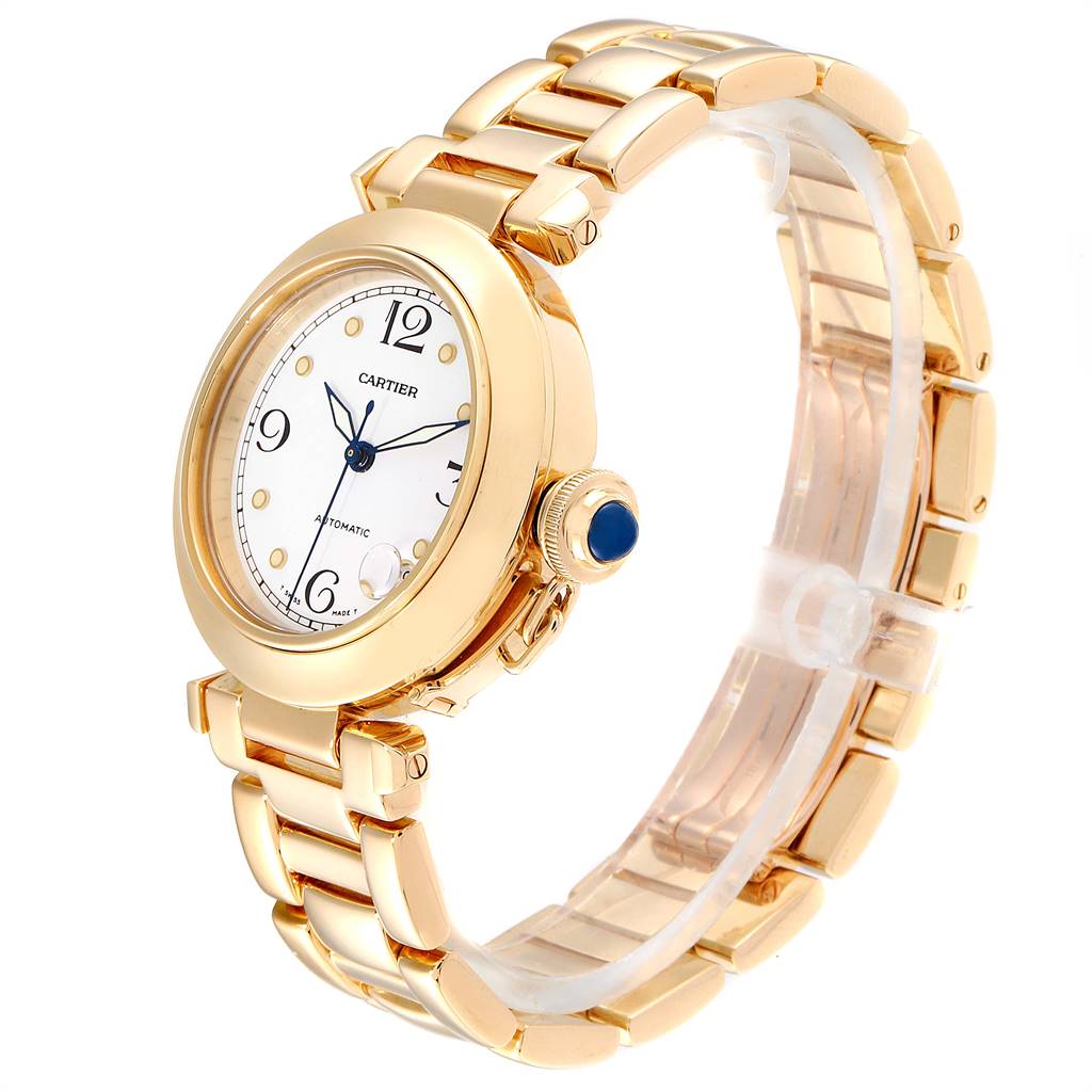 The image shows a Cartier Pasha WJ1110H9 Men's Yellow Gold White Dial WJ1110H9 Men's Yellow Gold White Dial watch at a three-quarter angle, highlighting its gold band and white dial with blue hands.