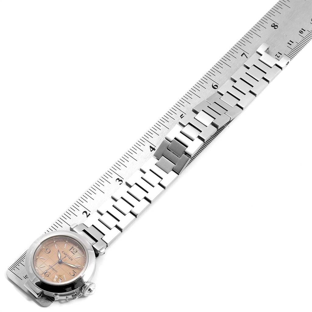 The image shows a side view of a Cartier Pasha W31024M7 Men's Stainless Steel Pink Dial W31024M7 Men's Stainless Steel Pink Dial watch with its bracelet aligned alongside a ruler for measurement.