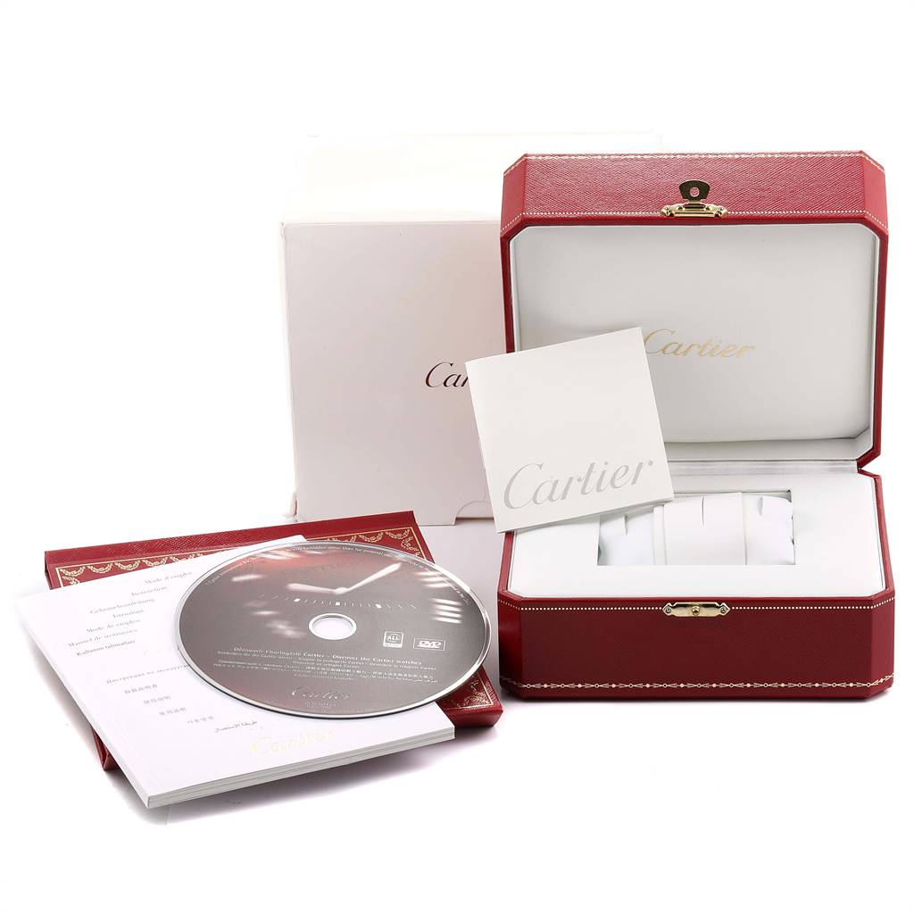 This image shows the packaging and accessories of a Cartier Pasha W31030H3 Men's Stainless Steel Silver Dial W31030H3 Men's Stainless Steel Silver Dial watch, including a box, booklet, CD, and cushion.