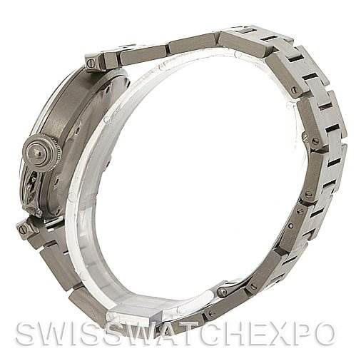 The image shows a side view of the Cartier Pasha W31075M7 Men
s Stainless Steel Pink Dial W31075M7 Men
s Stainless Steel Pink Dial watch, highlighting its crown, case, and metal bracelet.