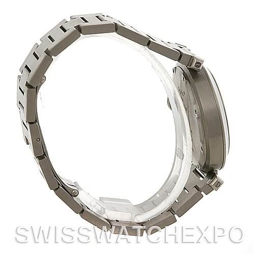 The image shows a side view of a Cartier Pasha W31075M7 Men
s Stainless Steel Pink Dial W31075M7 Men
s Stainless Steel Pink Dial watch, highlighting its metal bracelet and case.